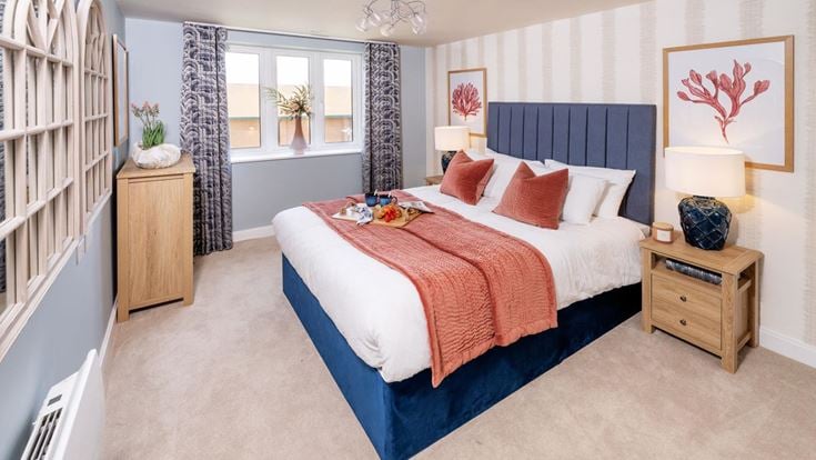 a bedroom with a bed and a bookcase