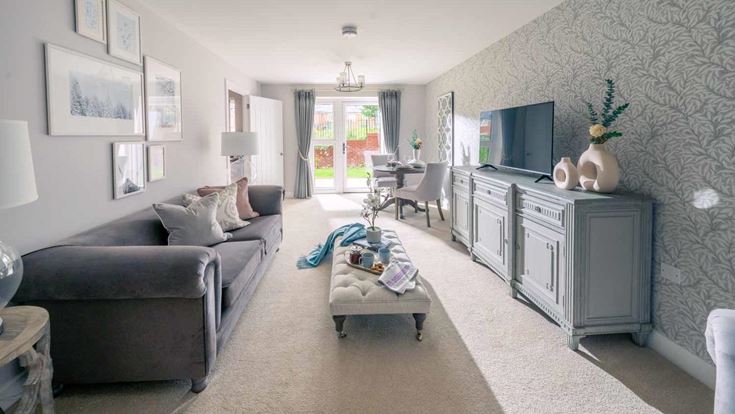 a living room with a couch and a tv