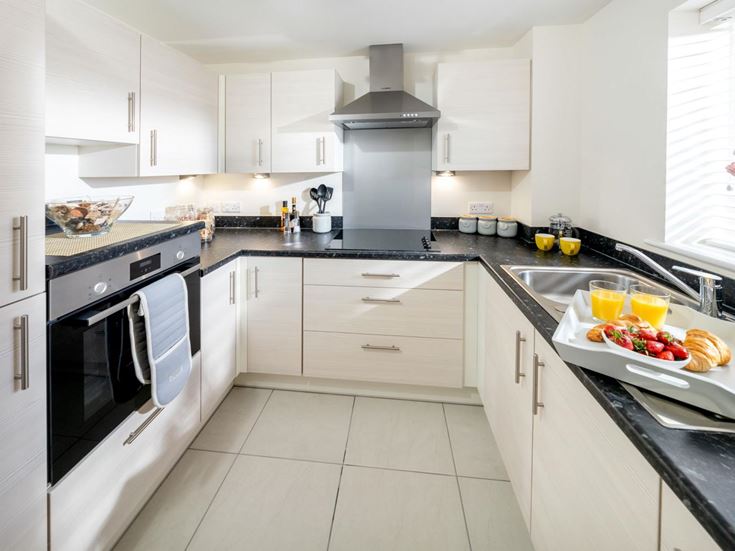 a kitchen with white cabinets