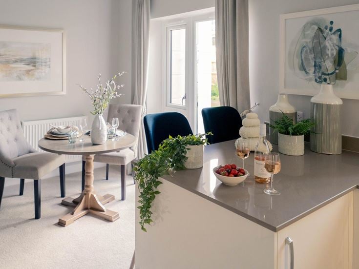 a dining room with a table and chairs