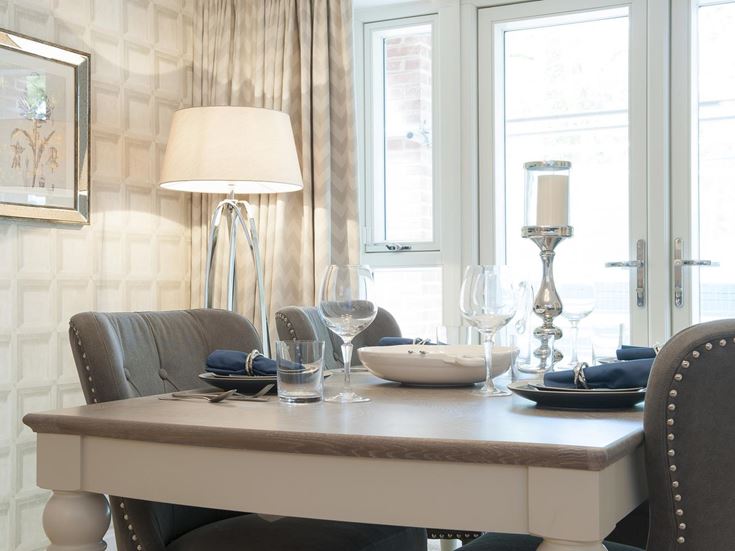 a table with glasses and plates on it