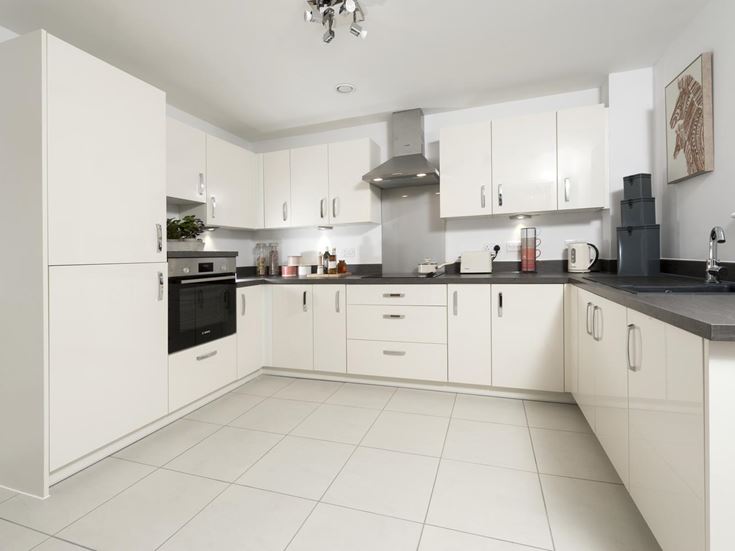 a kitchen with white cabinets
