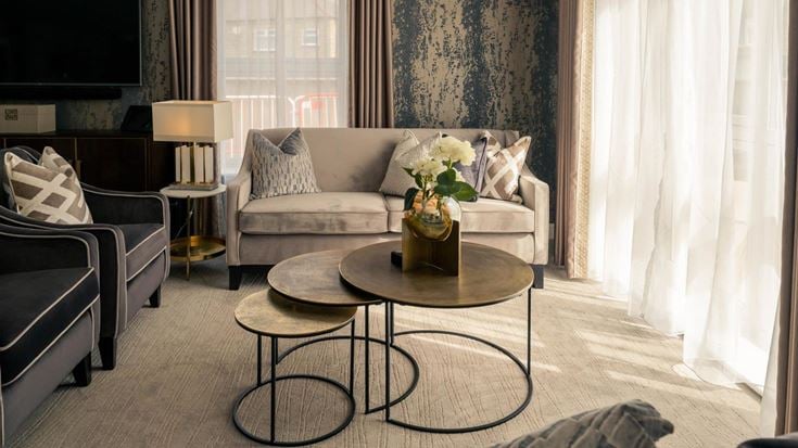 a living room with a couch and coffee table