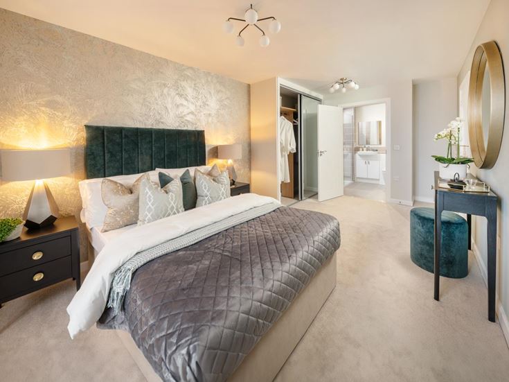 a bedroom with a bed and a mirror
