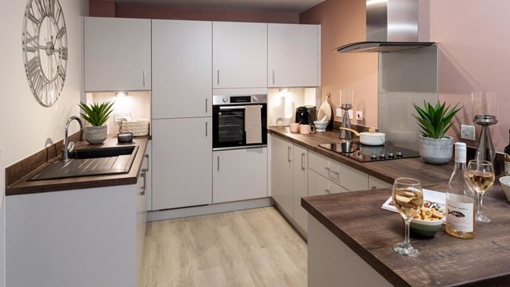 a kitchen with white cabinets