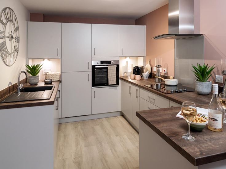 a kitchen with white cabinets