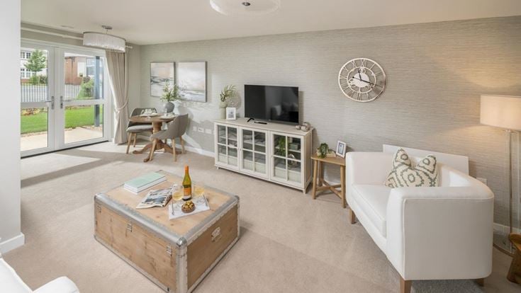 a living room with a tv and couches