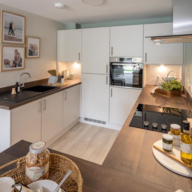 a kitchen with a table and a basket