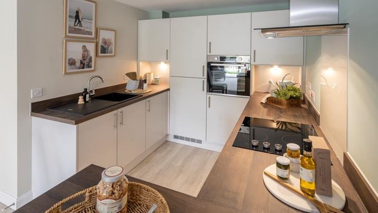 a kitchen with a table and a basket