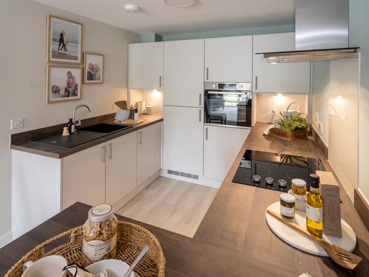 a kitchen with a table and a basket