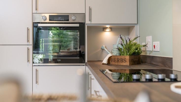 a kitchen with a glass door