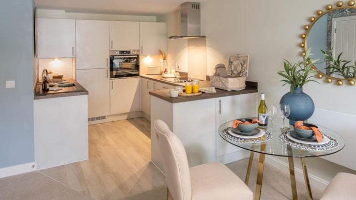 a kitchen with a dining table