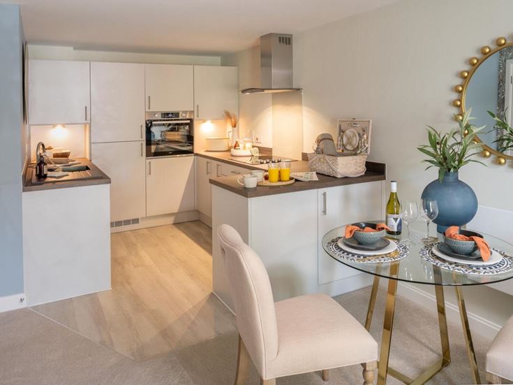 a kitchen with a dining table