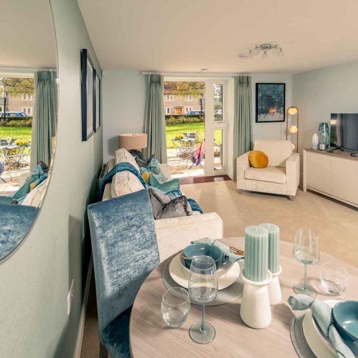 a living room with a table and chairs