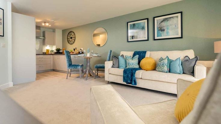 a living room with a couch and a table
