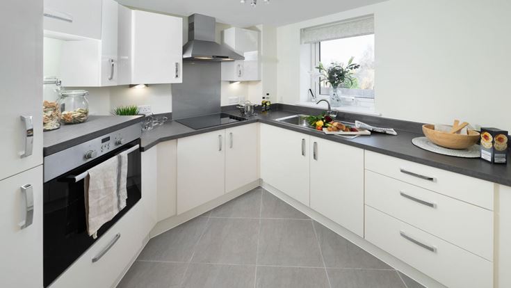 a kitchen with white cabinets