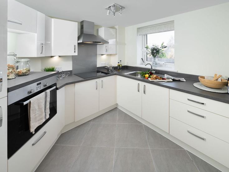 a kitchen with white cabinets