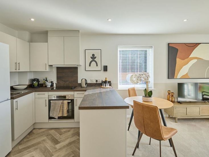 a kitchen with white cabinets