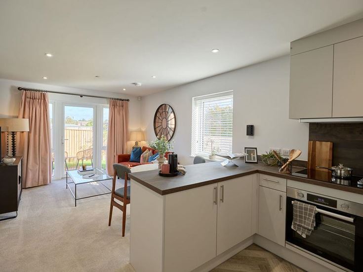 a kitchen with white cabinets