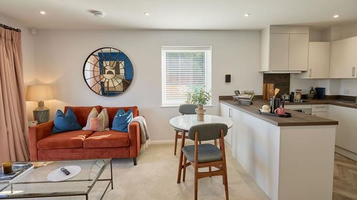 a living room with a couch and a table