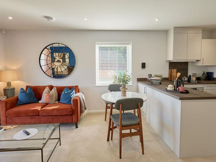 a living room with a couch and a table