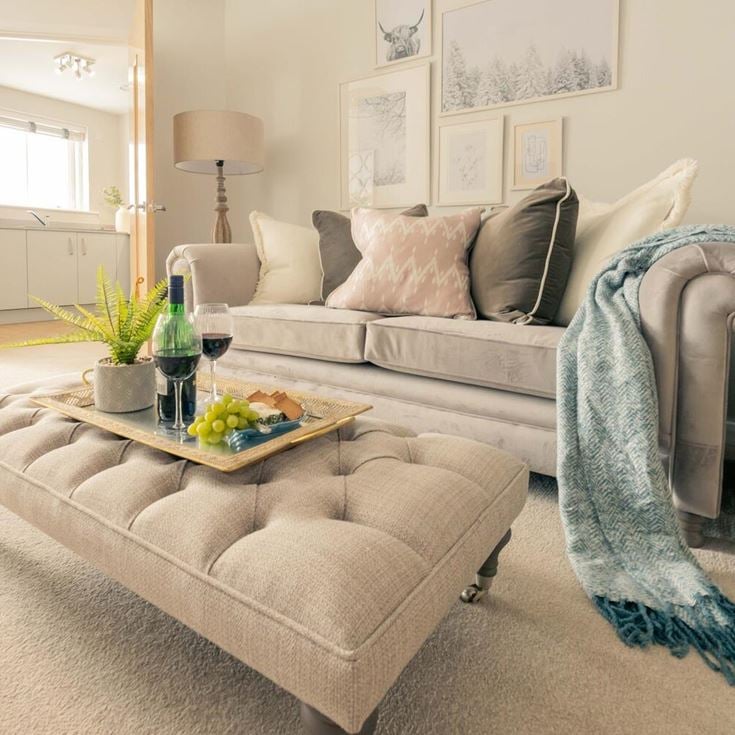 a couch and a table in a room with a couch and a coffee table