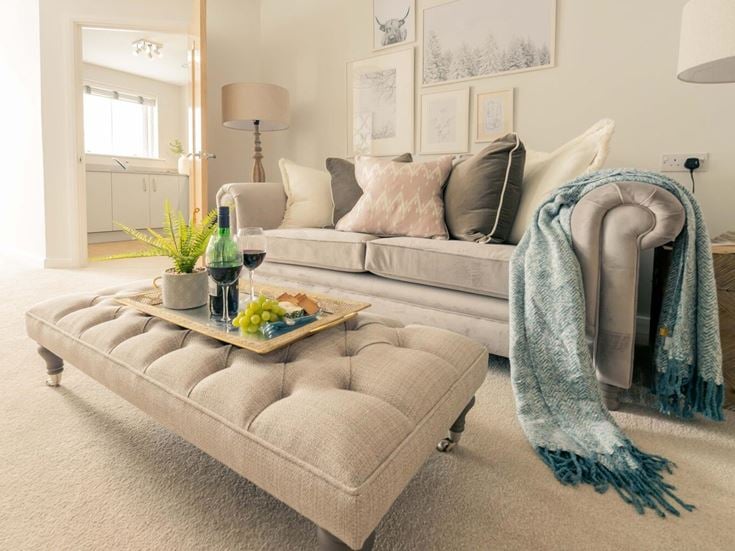 a couch and a table in a room with a couch and a coffee table