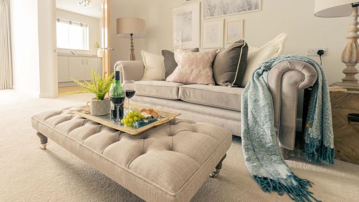 a couch and a table in a room with a couch and a coffee table