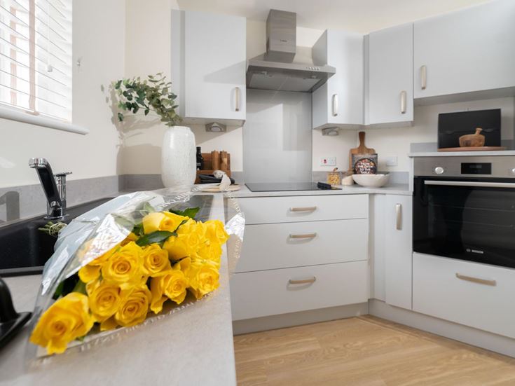 a kitchen with white cabinets