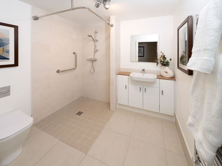 a bathroom with a shower and toilet
