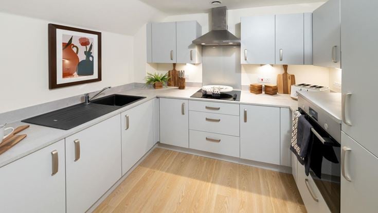 a kitchen with white cabinets