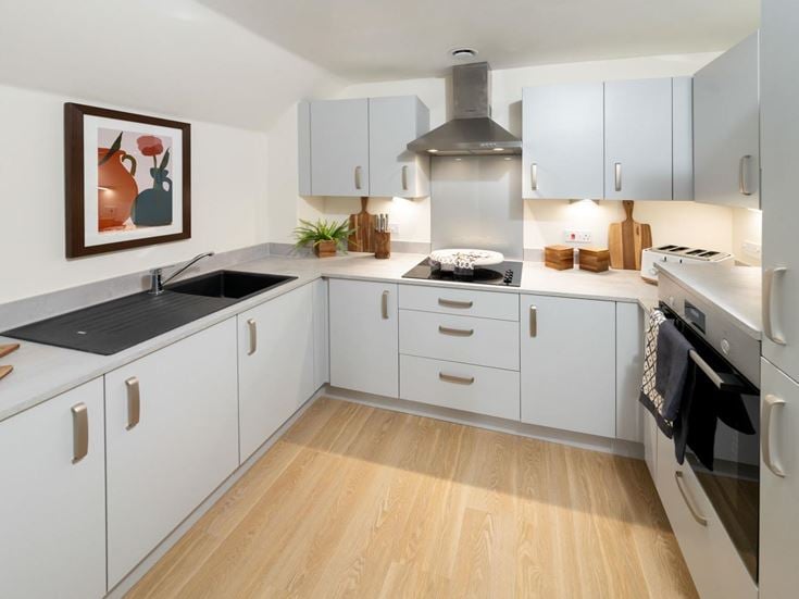a kitchen with white cabinets