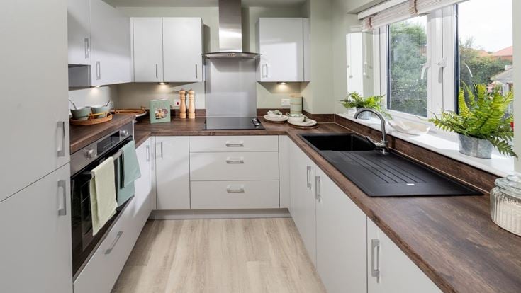 a kitchen with white cabinets