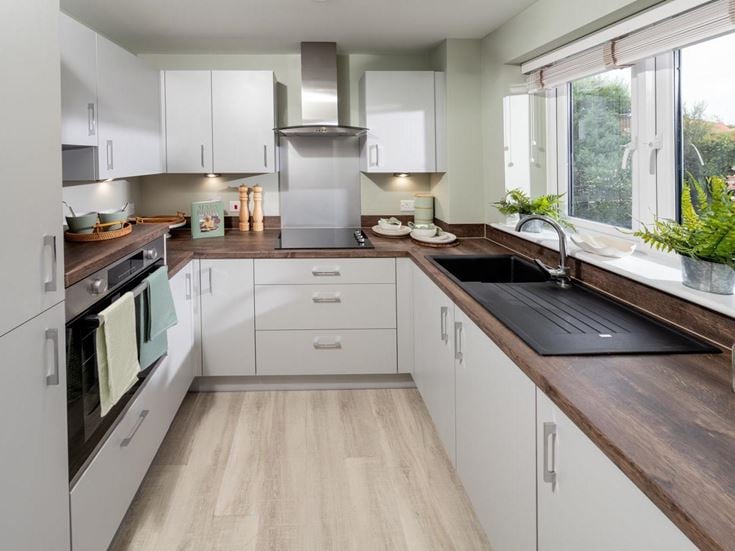 a kitchen with white cabinets