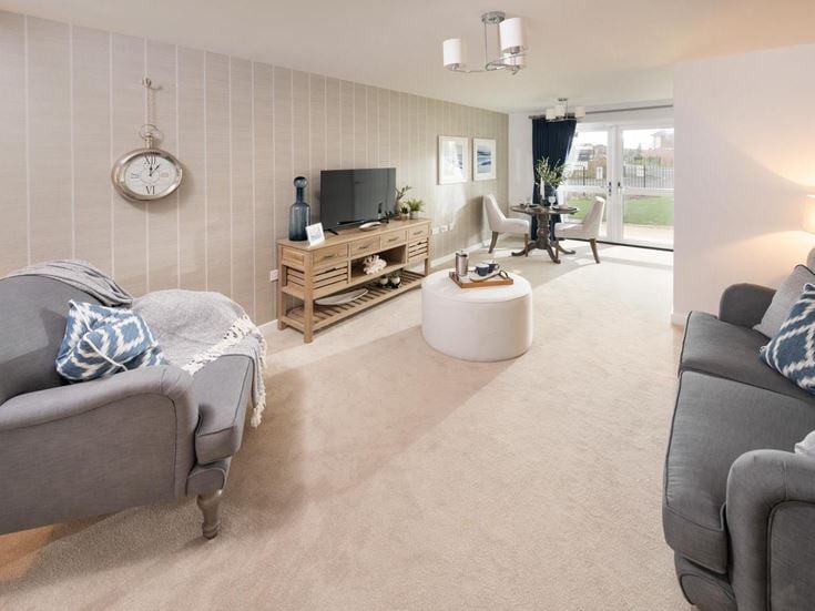 a living room with a couch and a tv