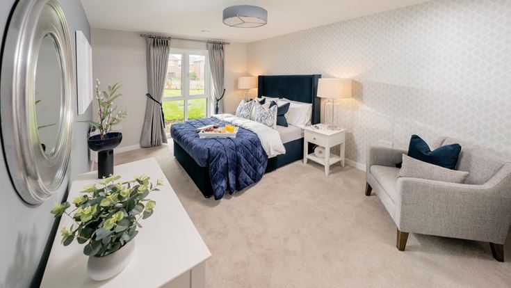 a bedroom with a bed and couches