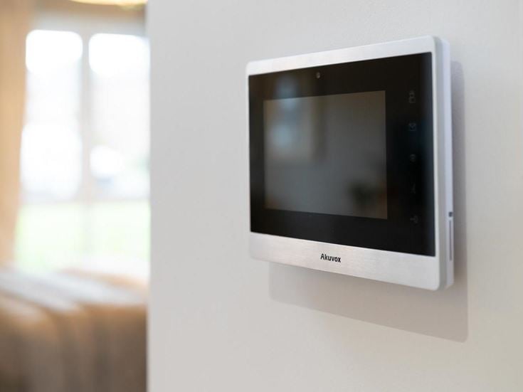 a white rectangular device on a white wall