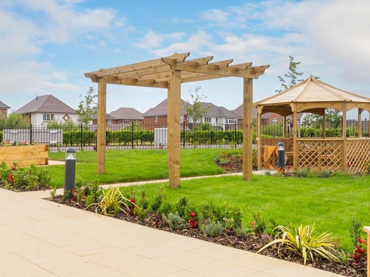 a garden with a gazebo