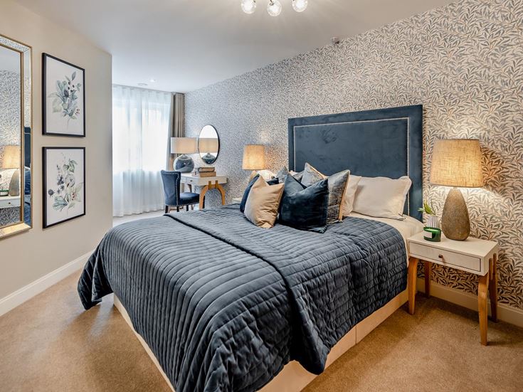 a bedroom with a bed and a mirror