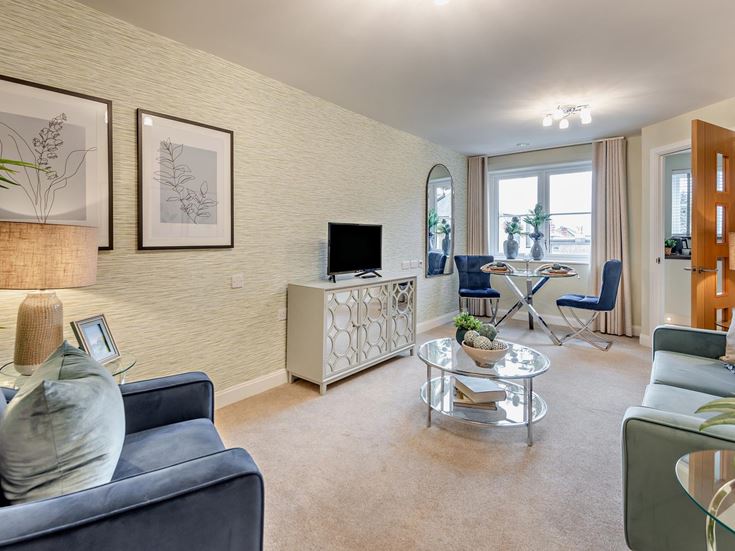 a living room with a tv and couches