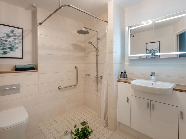 a bathroom with a shower and sink