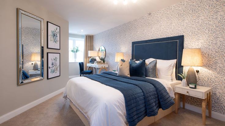 a bedroom with a bed and a mirror