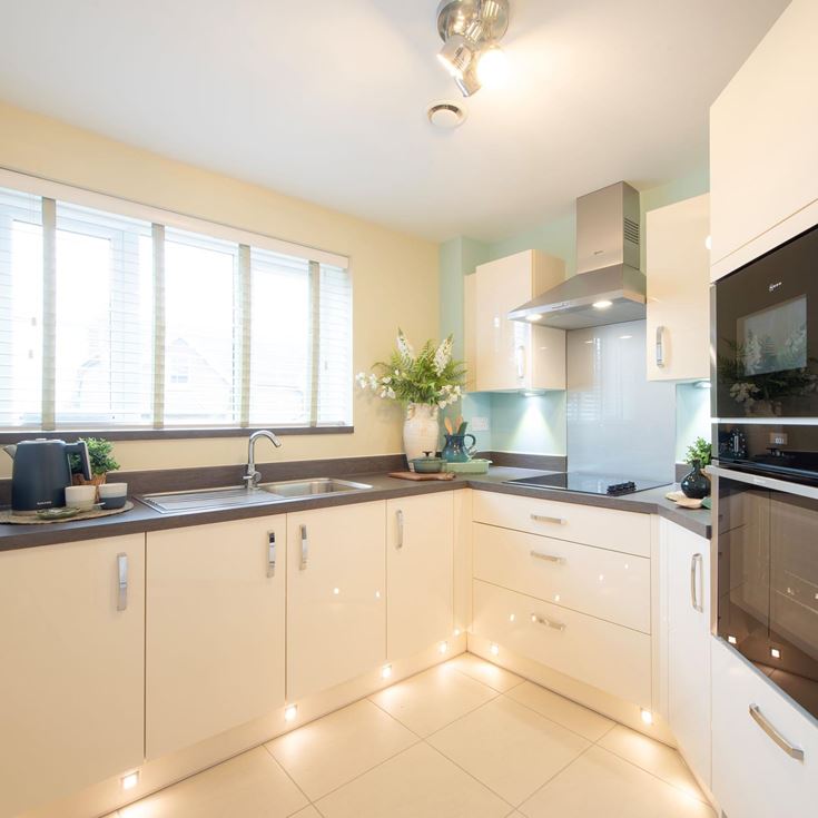 a kitchen with white cabinets