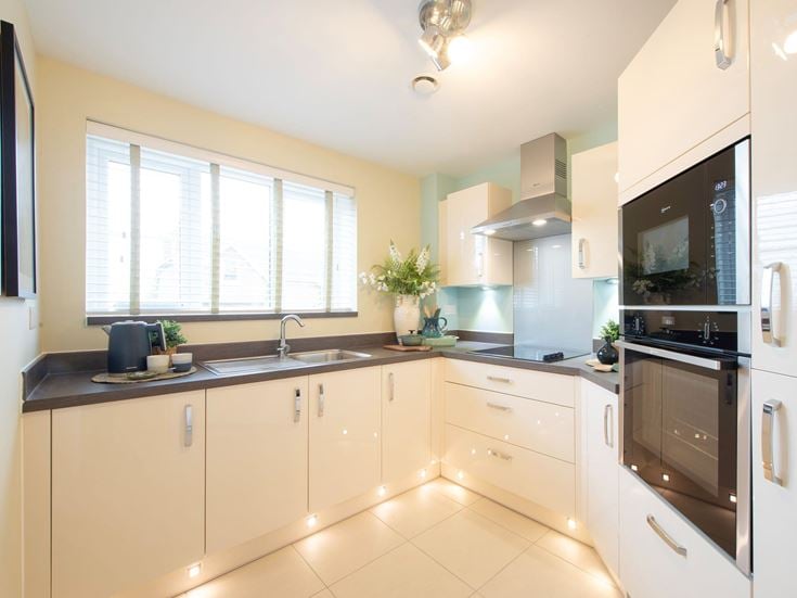 a kitchen with white cabinets