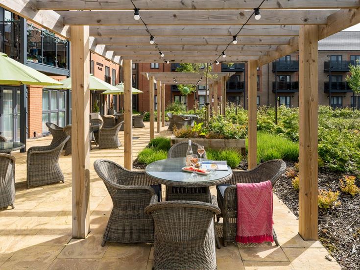 a patio with a table and chairs