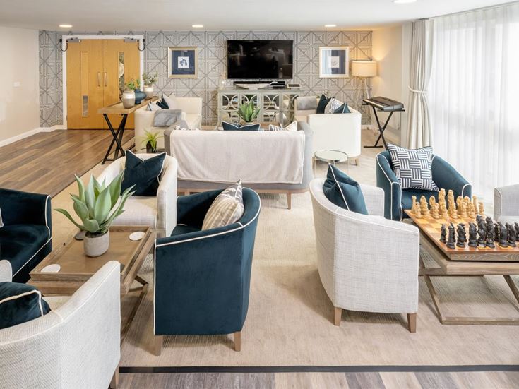 a living room with a couch and chairs