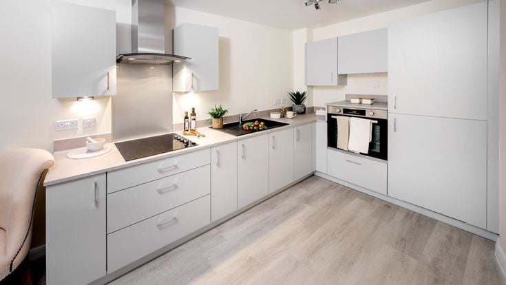 a kitchen with white cabinets