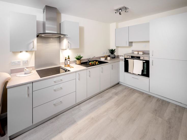 a kitchen with white cabinets