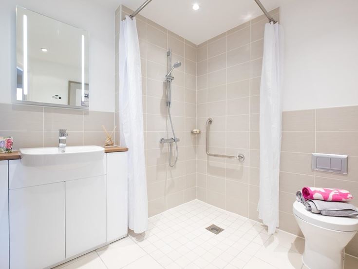 a bathroom with a shower and sink