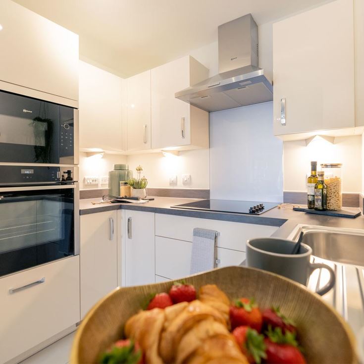 a kitchen with white cabinets